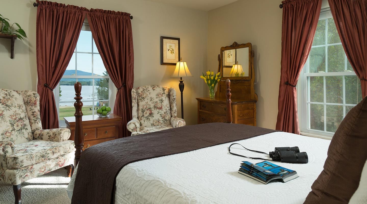 Bed and breakfast room overlooking the lake with queen bed