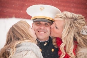 A soldier gets kissed